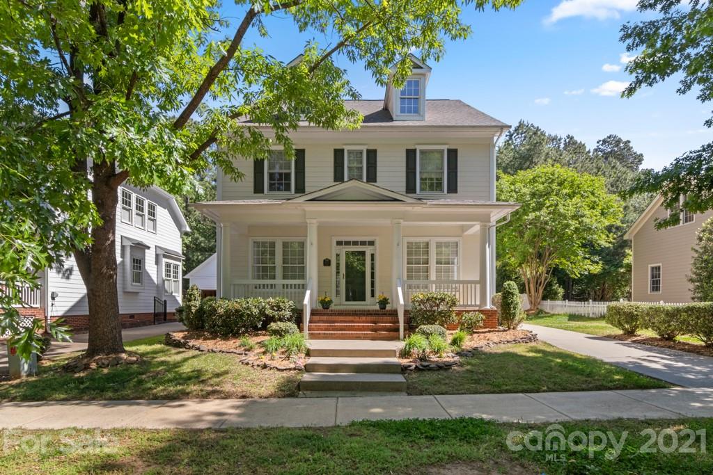 3272 Richard's Crossing, Unit 247 Fort Mill, SC 29708 - Photo 1 of 38 a front view of a house with garden