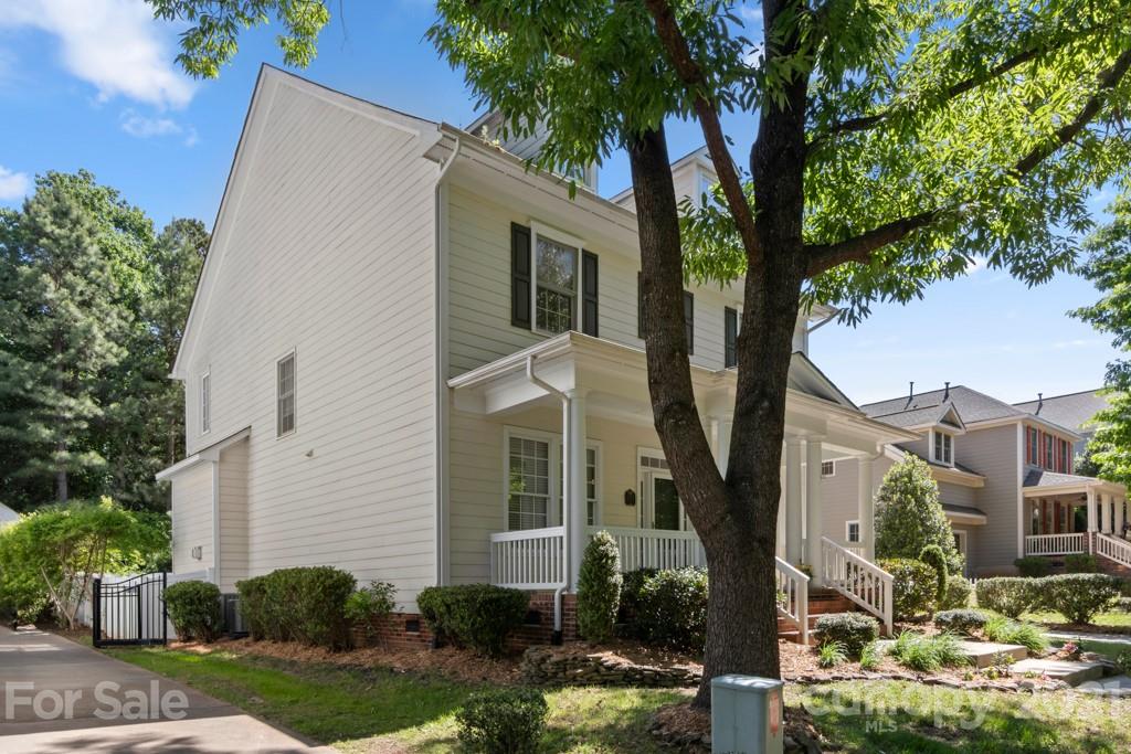 3272 Richard's Crossing, Unit 247 Fort Mill, SC 29708 - Photo 2 of 38 a view of a white house next to a tree