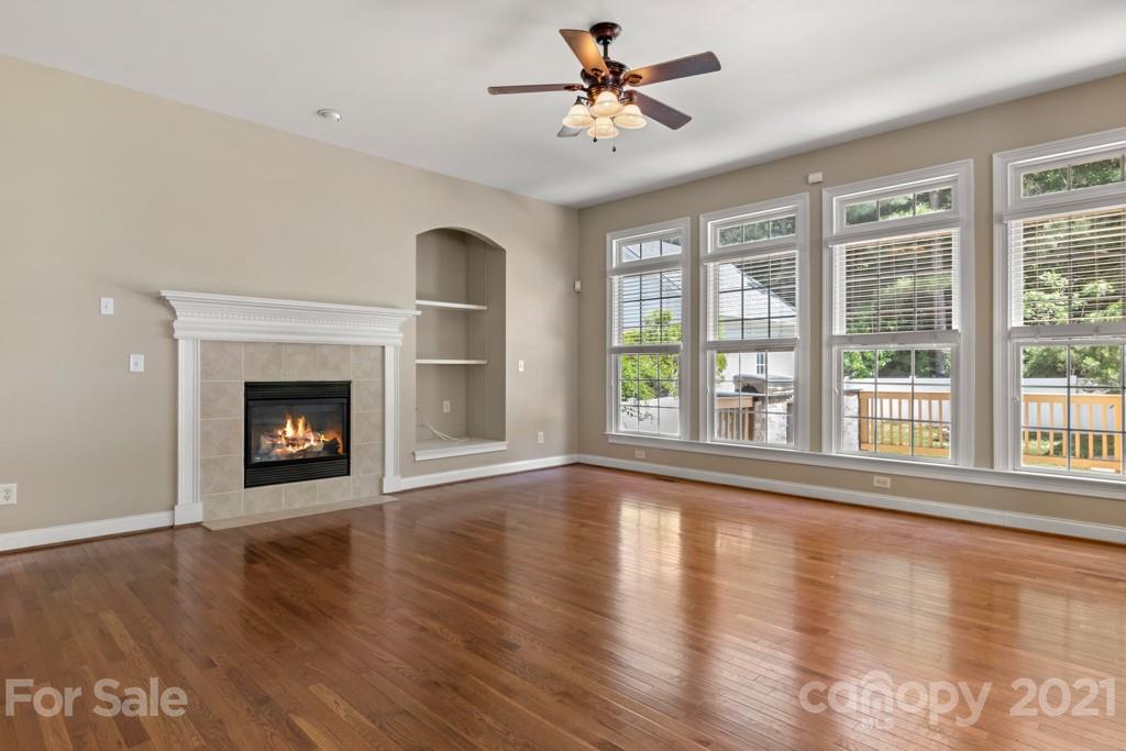 3272 Richard's Crossing, Unit 247 Fort Mill, SC 29708 - Photo 12 of 38 a view of an empty room with wooden floor and a window
