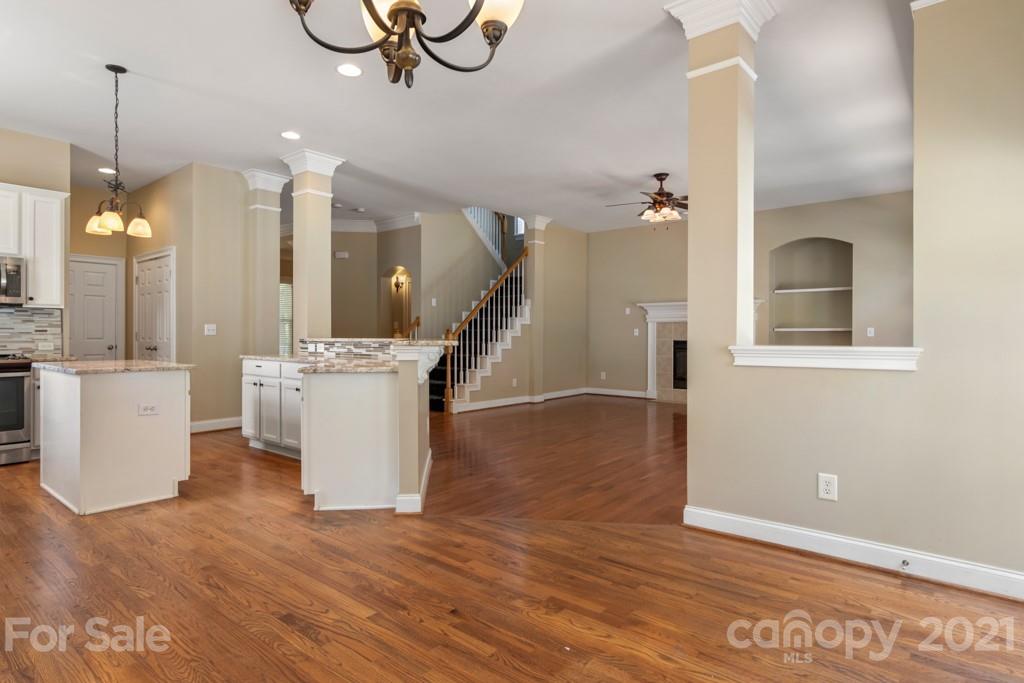 3272 Richard's Crossing, Unit 247 Fort Mill, SC 29708 - Photo 19 of 38 a view of a room with wooden floor and staircase