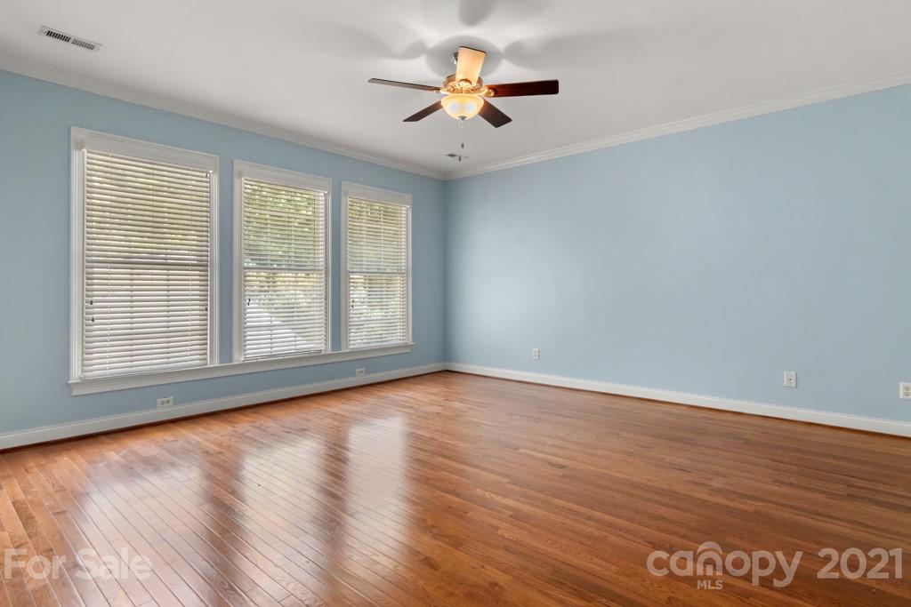 3272 Richard's Crossing, Unit 247 Fort Mill, SC 29708 - Photo 28 of 38 a view of an empty room with window and wooden floor