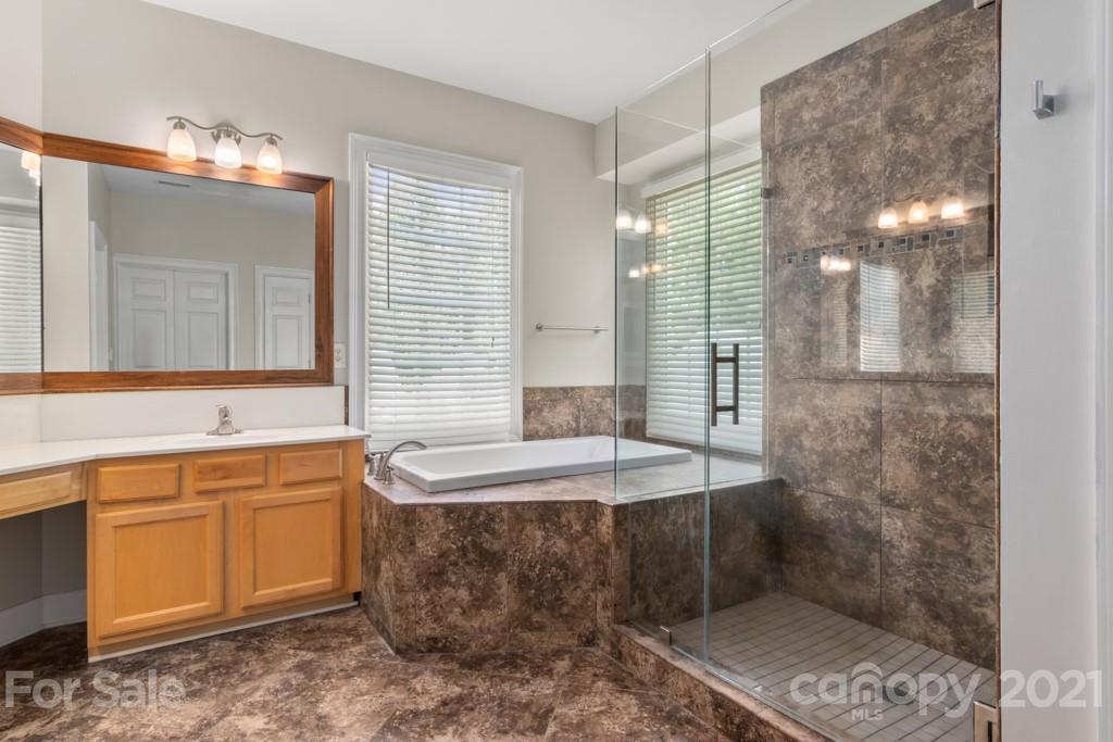3272 Richard's Crossing, Unit 247 Fort Mill, SC 29708 - Photo 30 of 38 a bath room with a sink and a mirror