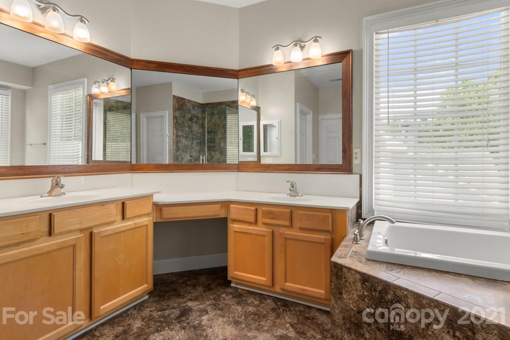 3272 Richard's Crossing, Unit 247 Fort Mill, SC 29708 - Photo 31 of 38 a bathroom with a sink and a mirror