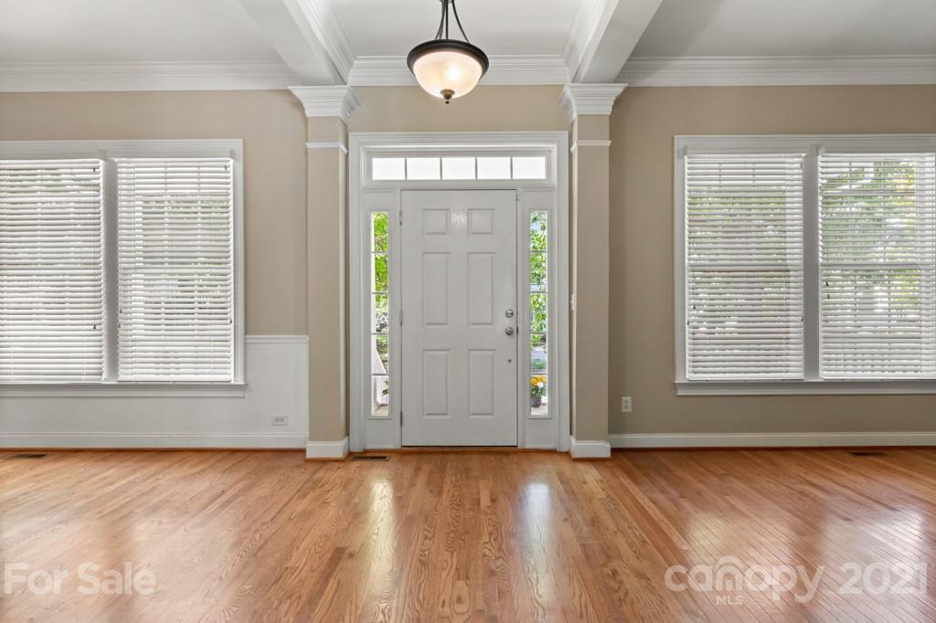 3272 Richard's Crossing, Unit 247 Fort Mill, SC 29708 - Photo 6 of 38 an empty room with wooden floor and windows