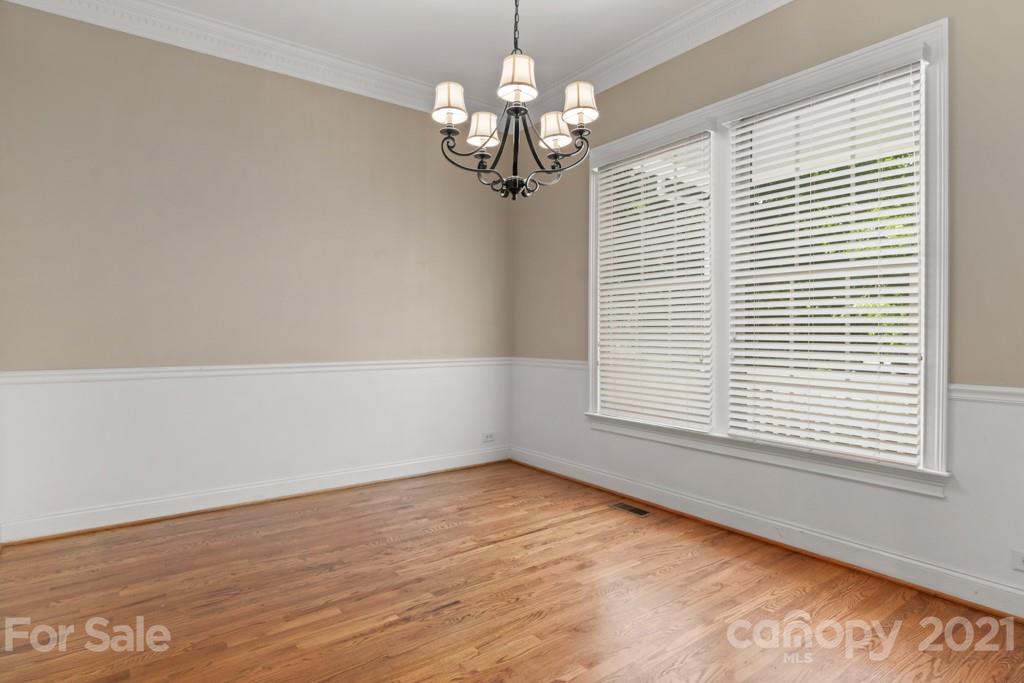 3272 Richard's Crossing, Unit 247 Fort Mill, SC 29708 - Photo 7 of 38 an empty room with wooden floor and windows