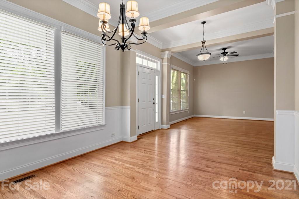 3272 Richard's Crossing, Unit 247 Fort Mill, SC 29708 - Photo 8 of 38 a view of an empty room with wooden floor and a window