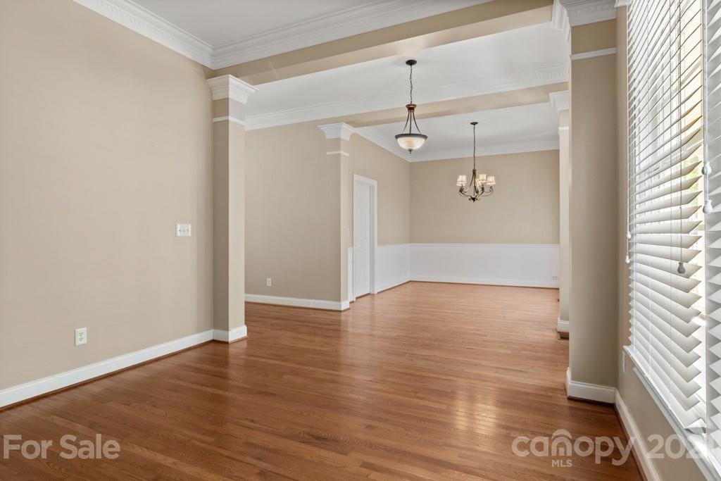 3272 Richard's Crossing, Unit 247 Fort Mill, SC 29708 - Photo 9 of 38 a view of an empty room with wooden floor and a window