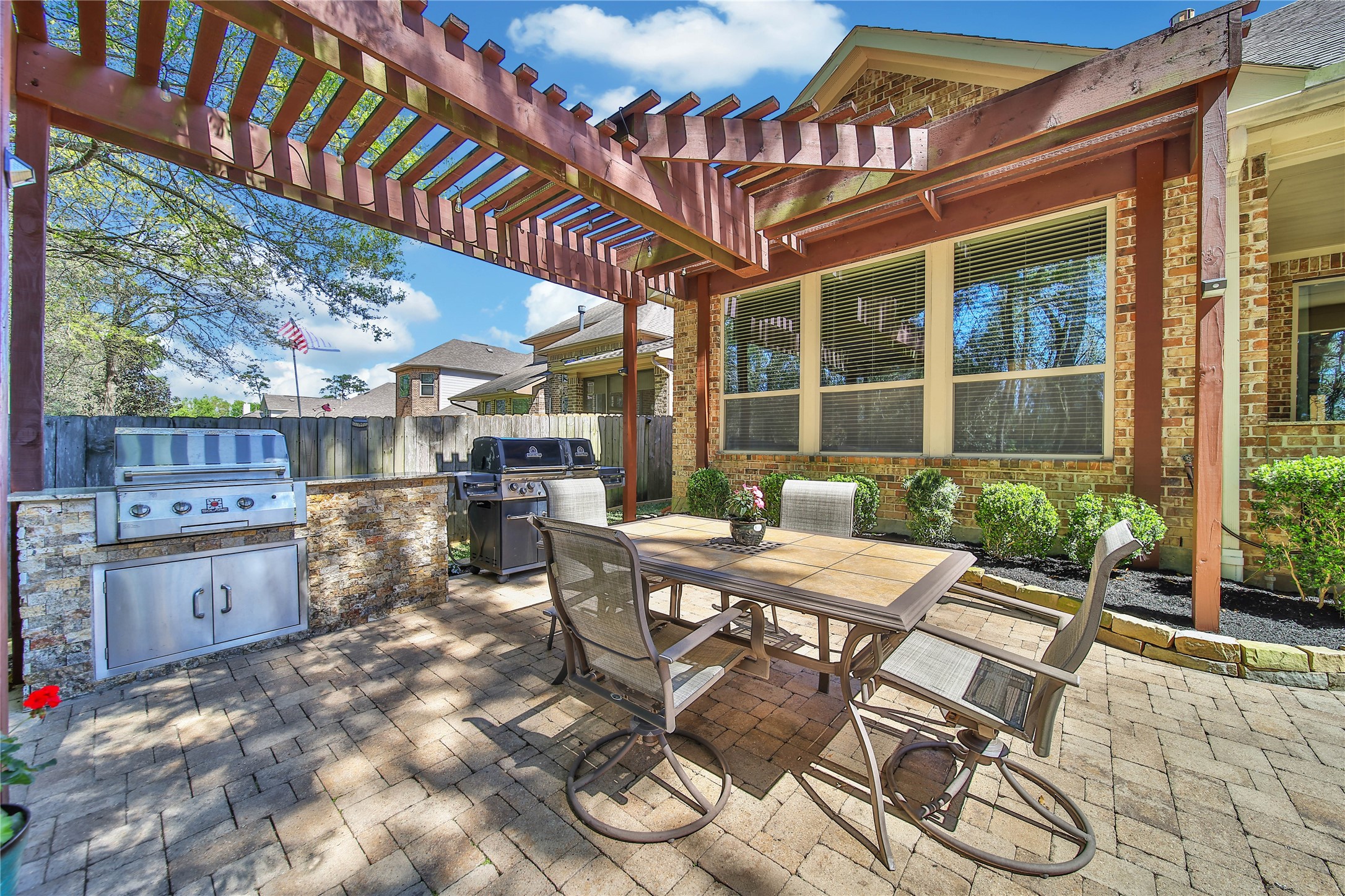 3234 Explorer Way Conroe, TX 77301 - Photo 45 of 46 A built-in grill and pergola extend the home's living space into the outdoors.