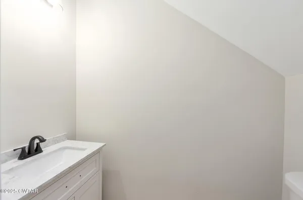 a bathroom with a sink and mirror