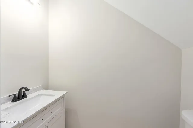 a bathroom with a sink and mirror