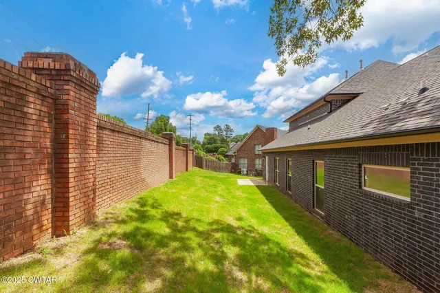 a view of a backyard with plants