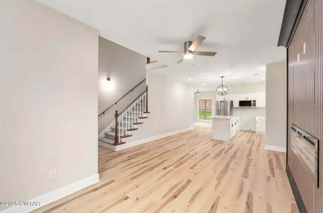 a view of a living room with a large window