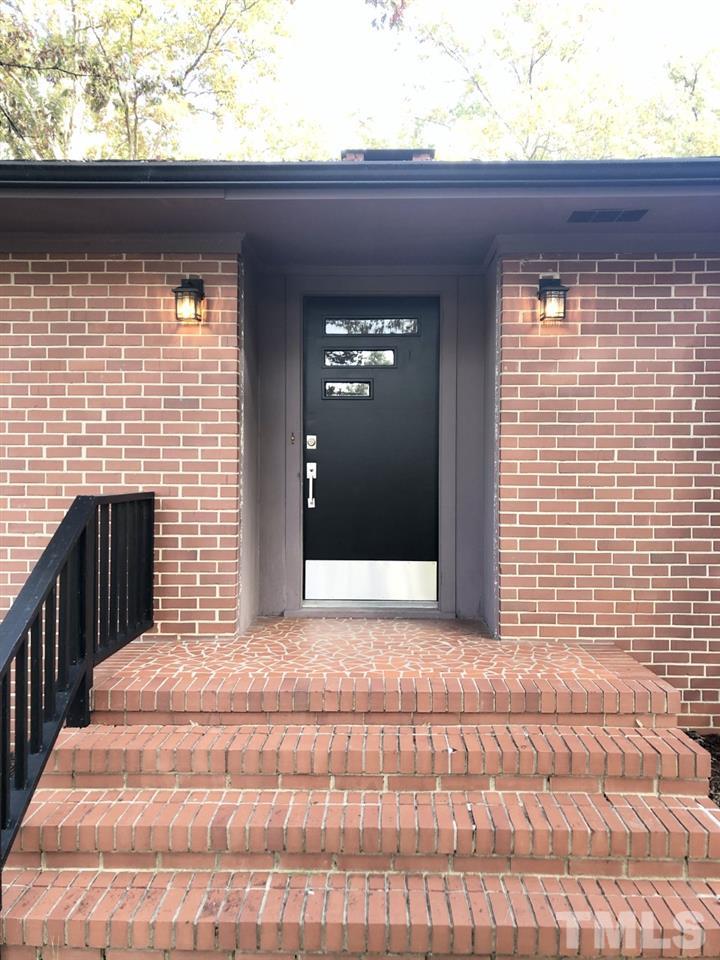 521 Buck Jones Road Raleigh, NC 27606 - Photo 2 of 30 a view of empty room with wooden floor