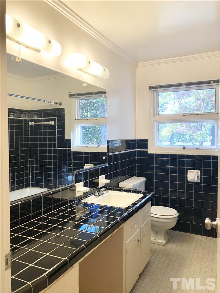521 Buck Jones Road Raleigh, NC 27606 - Photo 12 of 30 a bathroom with a sink toilet and shower