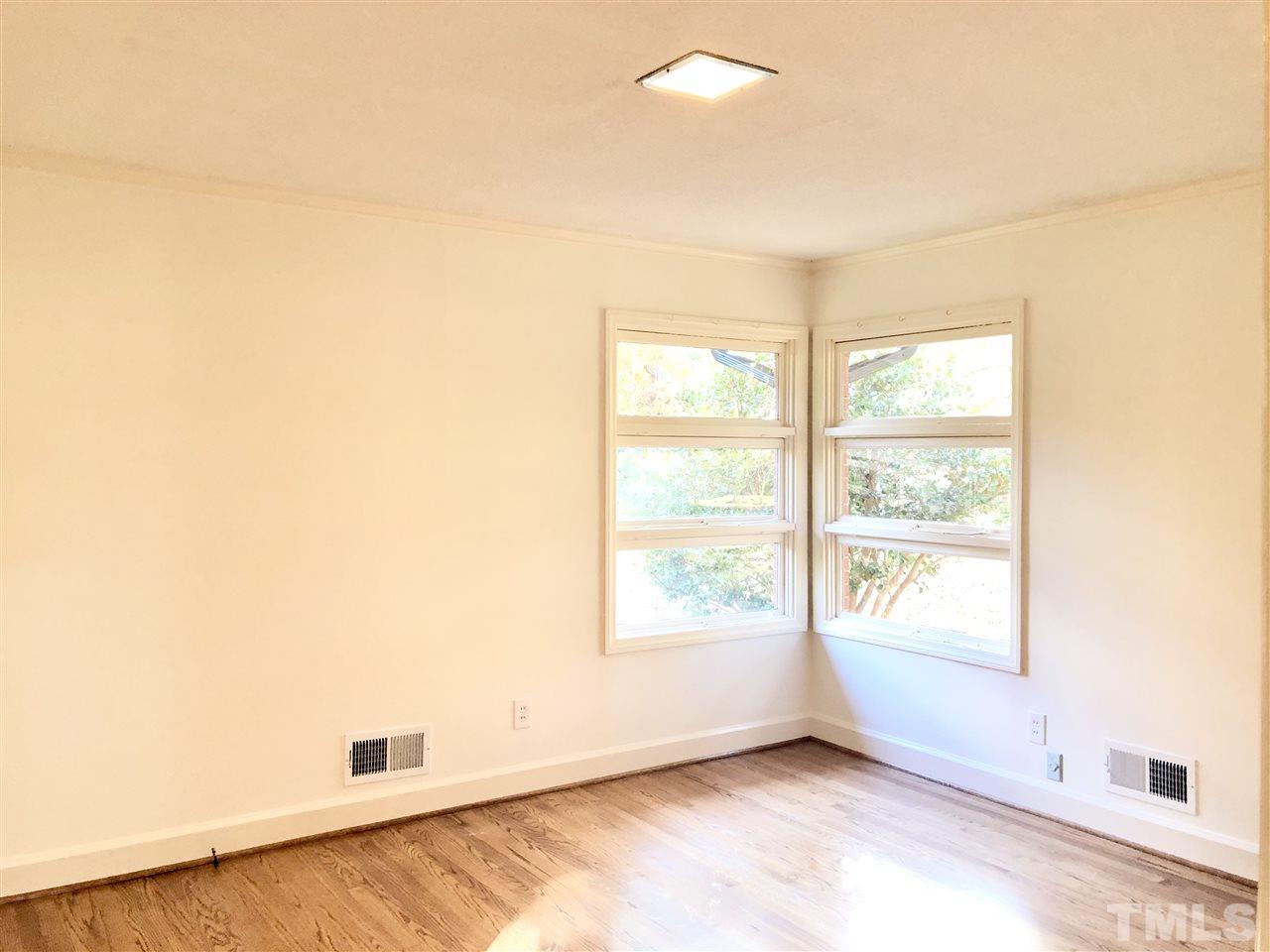521 Buck Jones Road Raleigh, NC 27606 - Photo 13 of 30 an empty room with windows