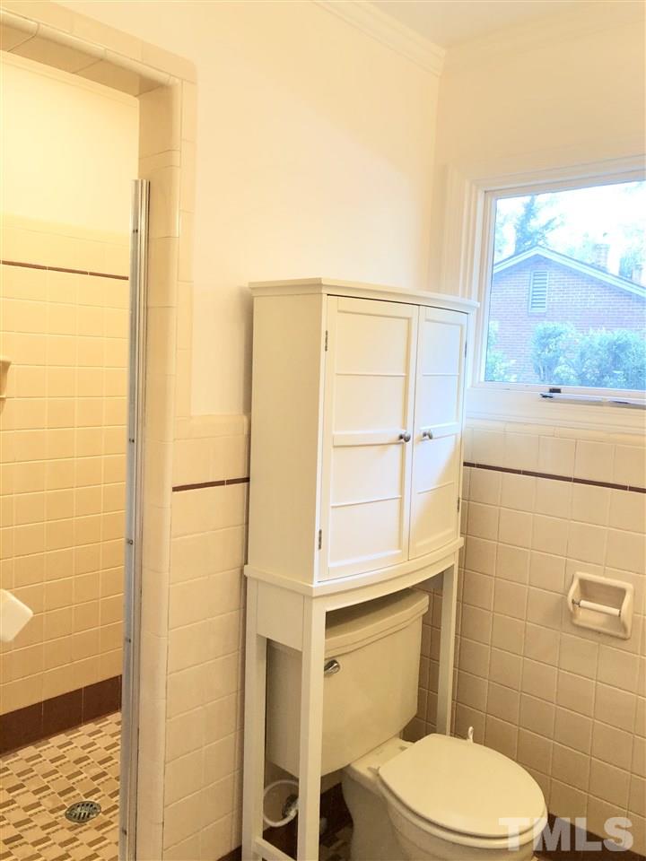 521 Buck Jones Road Raleigh, NC 27606 - Photo 16 of 30 a bathroom with a toilet and a shower