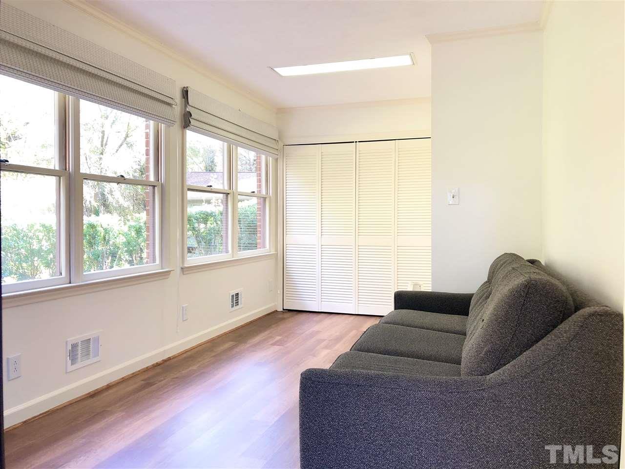 521 Buck Jones Road Raleigh, NC 27606 - Photo 17 of 30 a living room with furniture and a large window