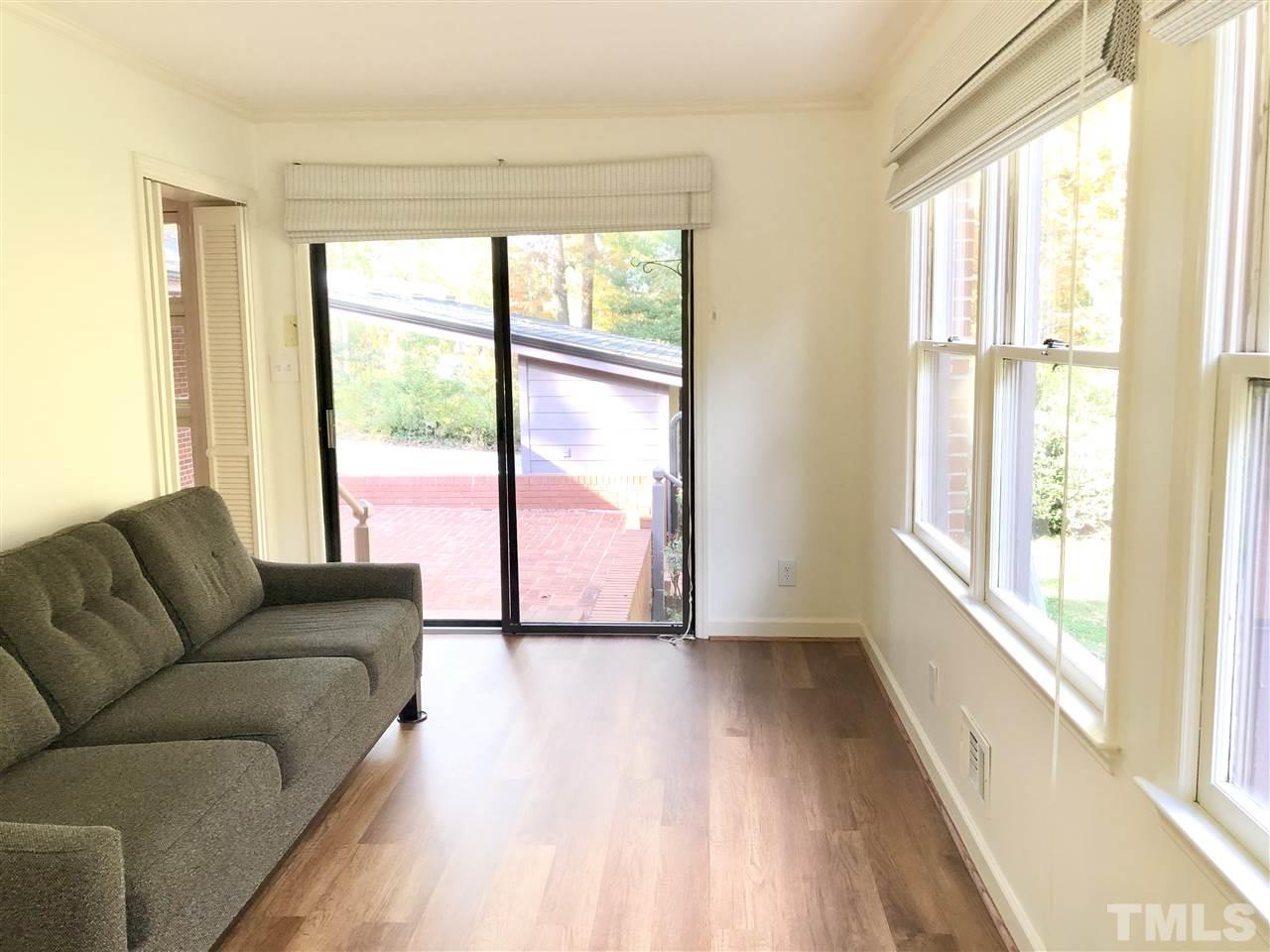 521 Buck Jones Road Raleigh, NC 27606 - Photo 18 of 30 a living room with furniture and a large window