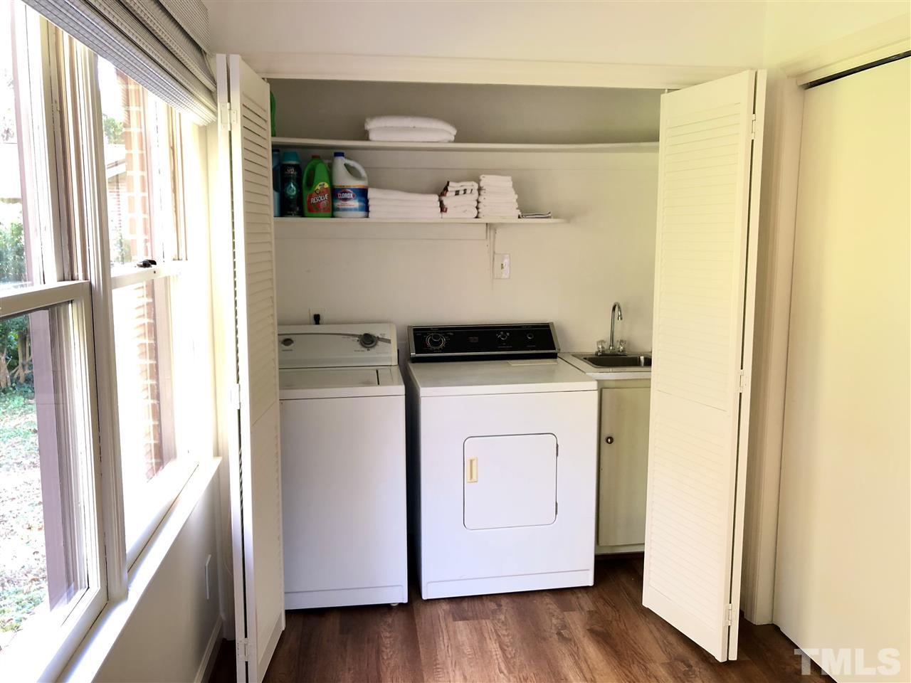521 Buck Jones Road Raleigh, NC 27606 - Photo 19 of 30 a view of washer and dryer with wooden floor