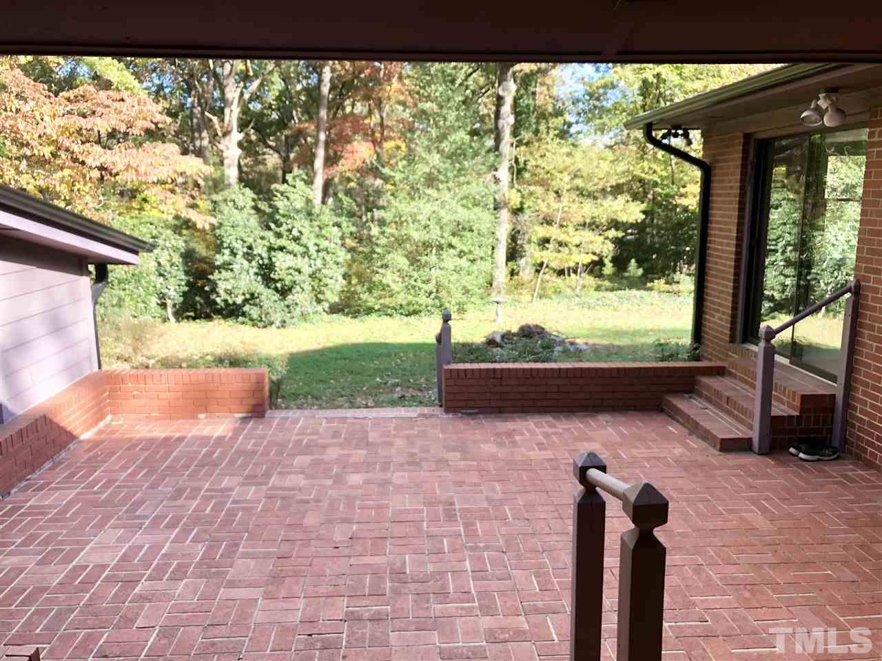 521 Buck Jones Road Raleigh, NC 27606 - Photo 20 of 30 a view of a porch and garden