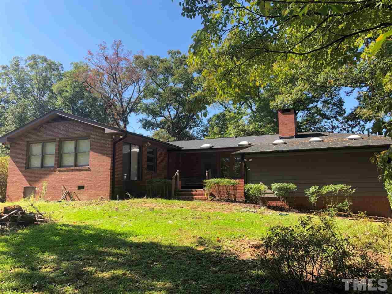 521 Buck Jones Road Raleigh, NC 27606 - Photo 26 of 30 a front view of a house with garden