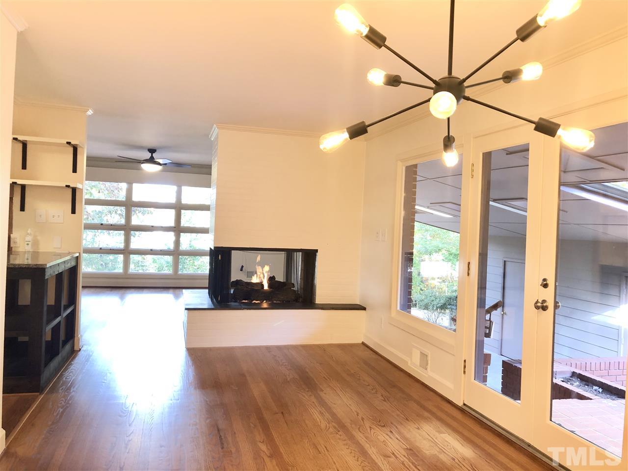 521 Buck Jones Road Raleigh, NC 27606 - Photo 7 of 30 a view of a living room and a fireplace