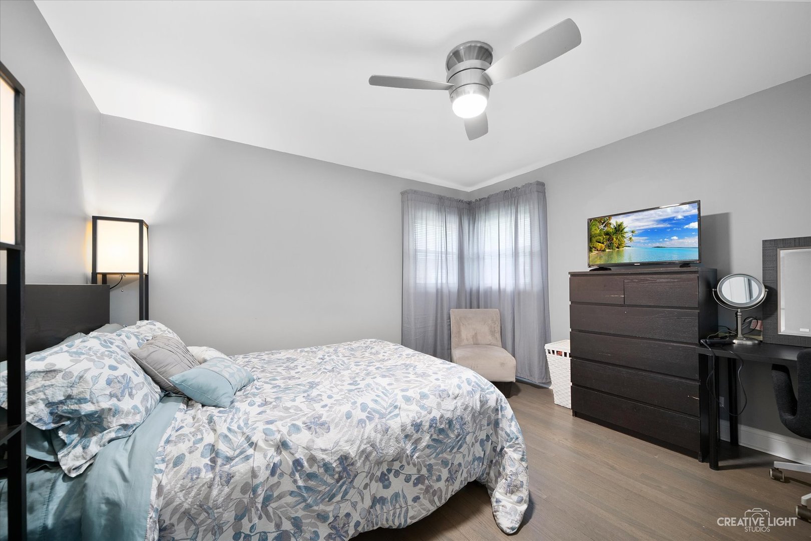 650 West Ronald Drive Addison, IL 60101 - Photo 12 of 14 a bedroom with a bed and a chandelier