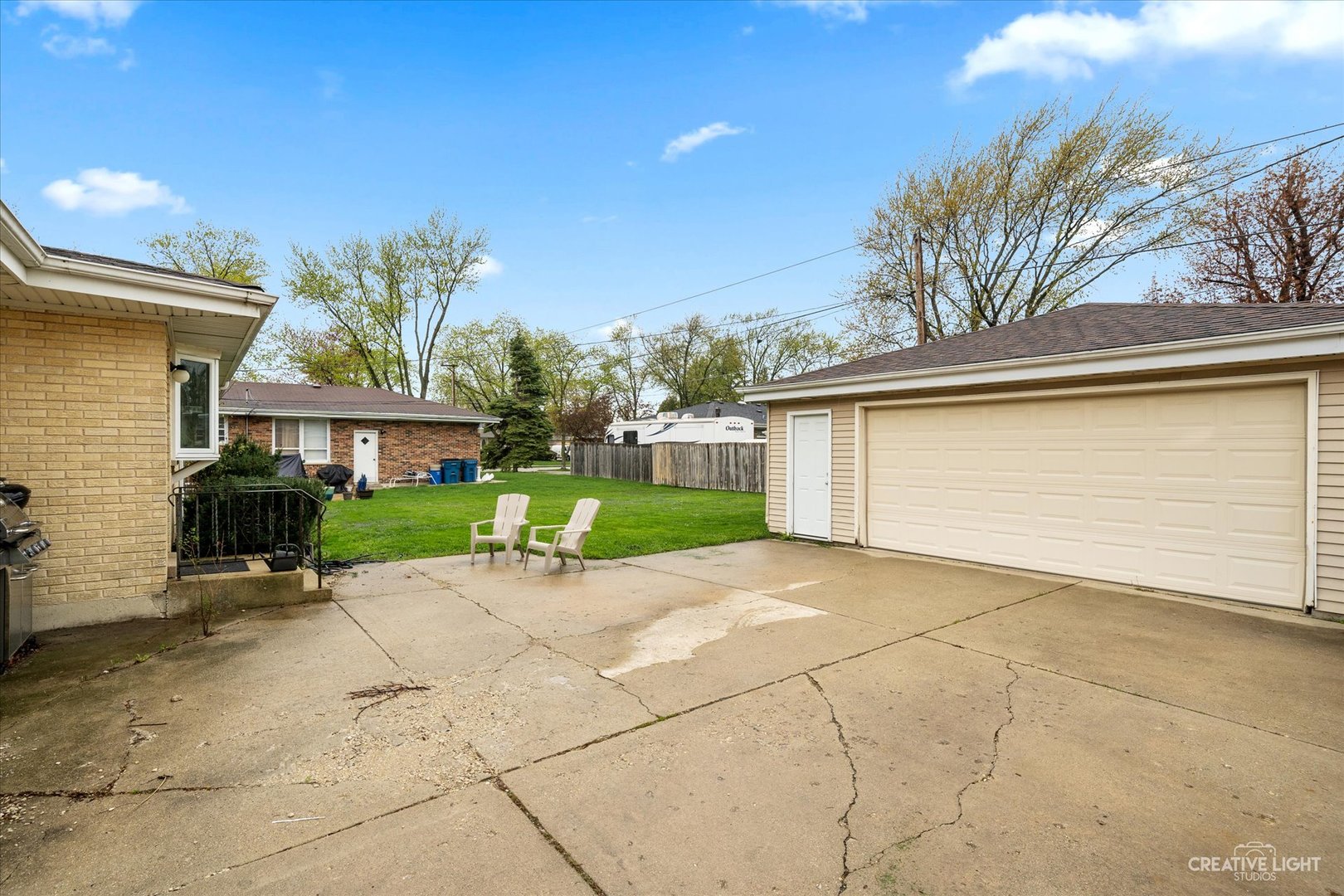 650 West Ronald Drive Addison, IL 60101 - Photo 13 of 14 a view of a house with a backyard and a garage