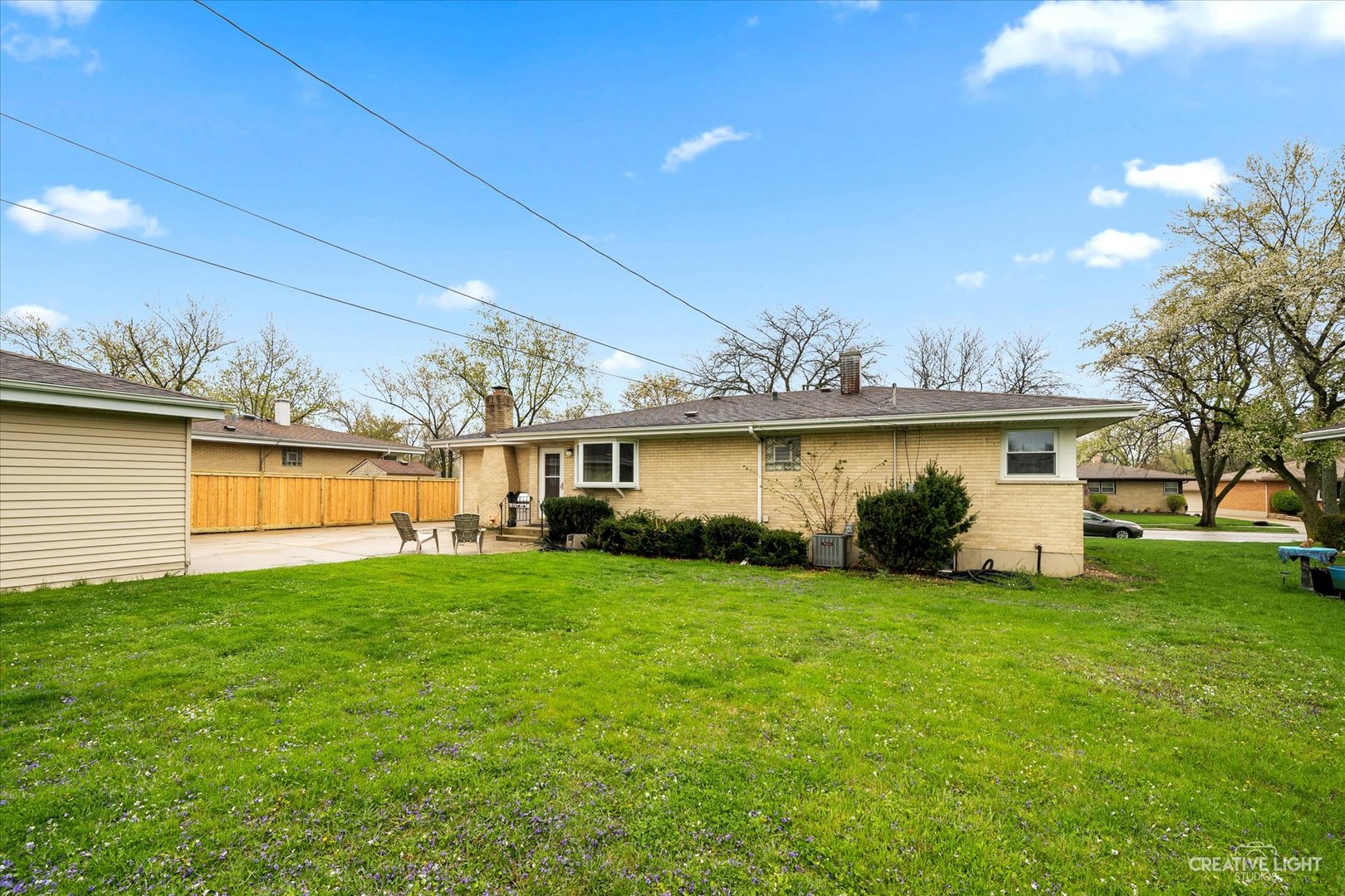 650 West Ronald Drive Addison, IL 60101 - Photo 14 of 14 a view of a house with a yard and a large tree
