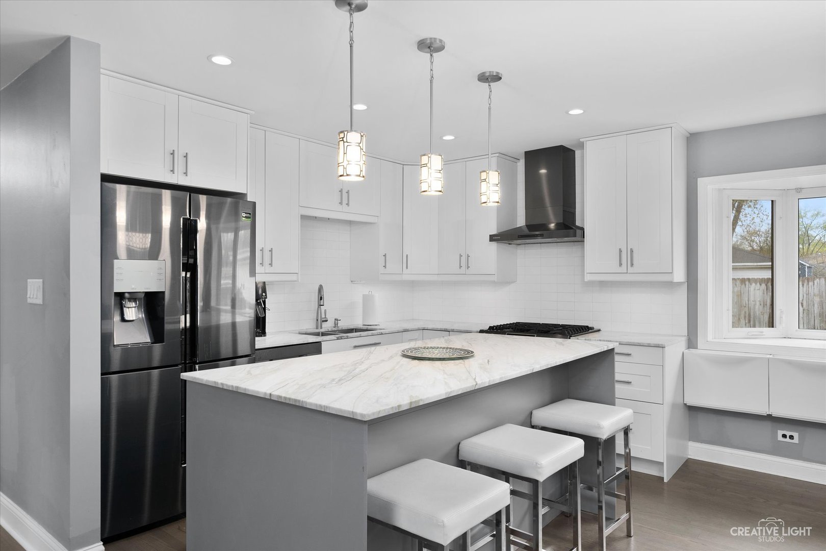 650 West Ronald Drive Addison, IL 60101 - Photo 4 of 14 a kitchen with a sink center island and stainless steel appliances