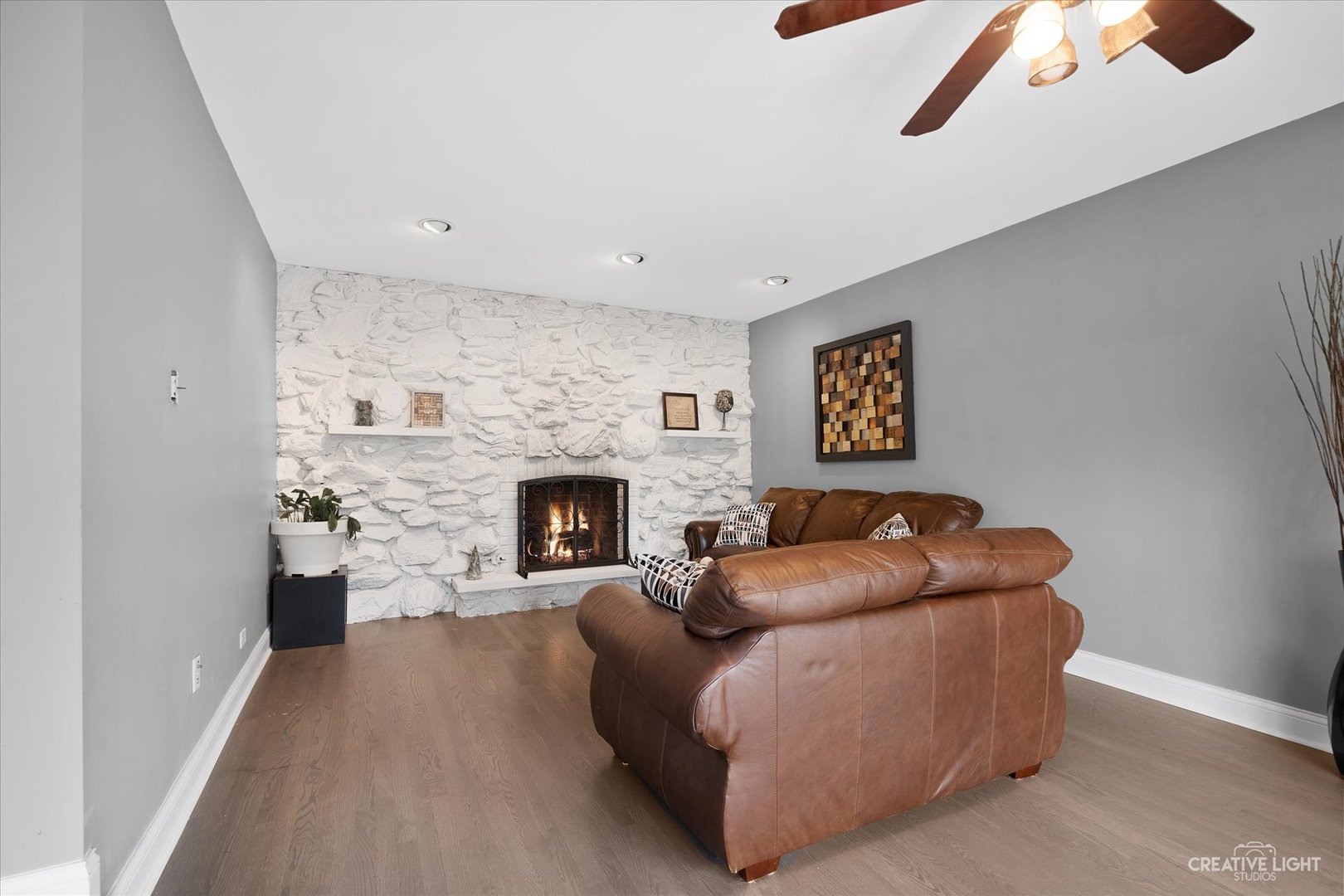 650 West Ronald Drive Addison, IL 60101 - Photo 7 of 14 a living room with furniture and a fireplace