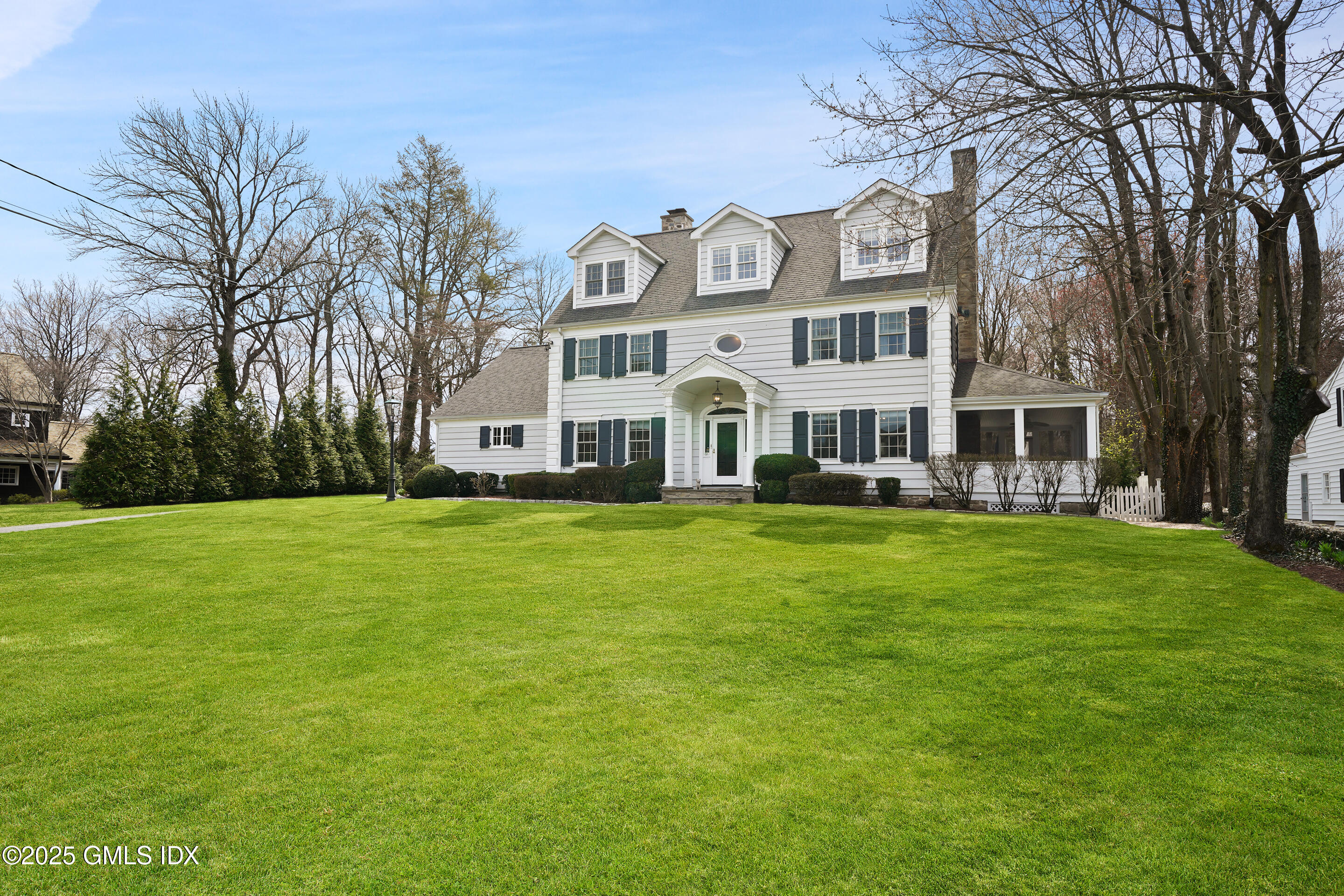 15 Anderson Road Greenwich, CT 06830 - Photo 1 of 7 a front view of a house with a garden