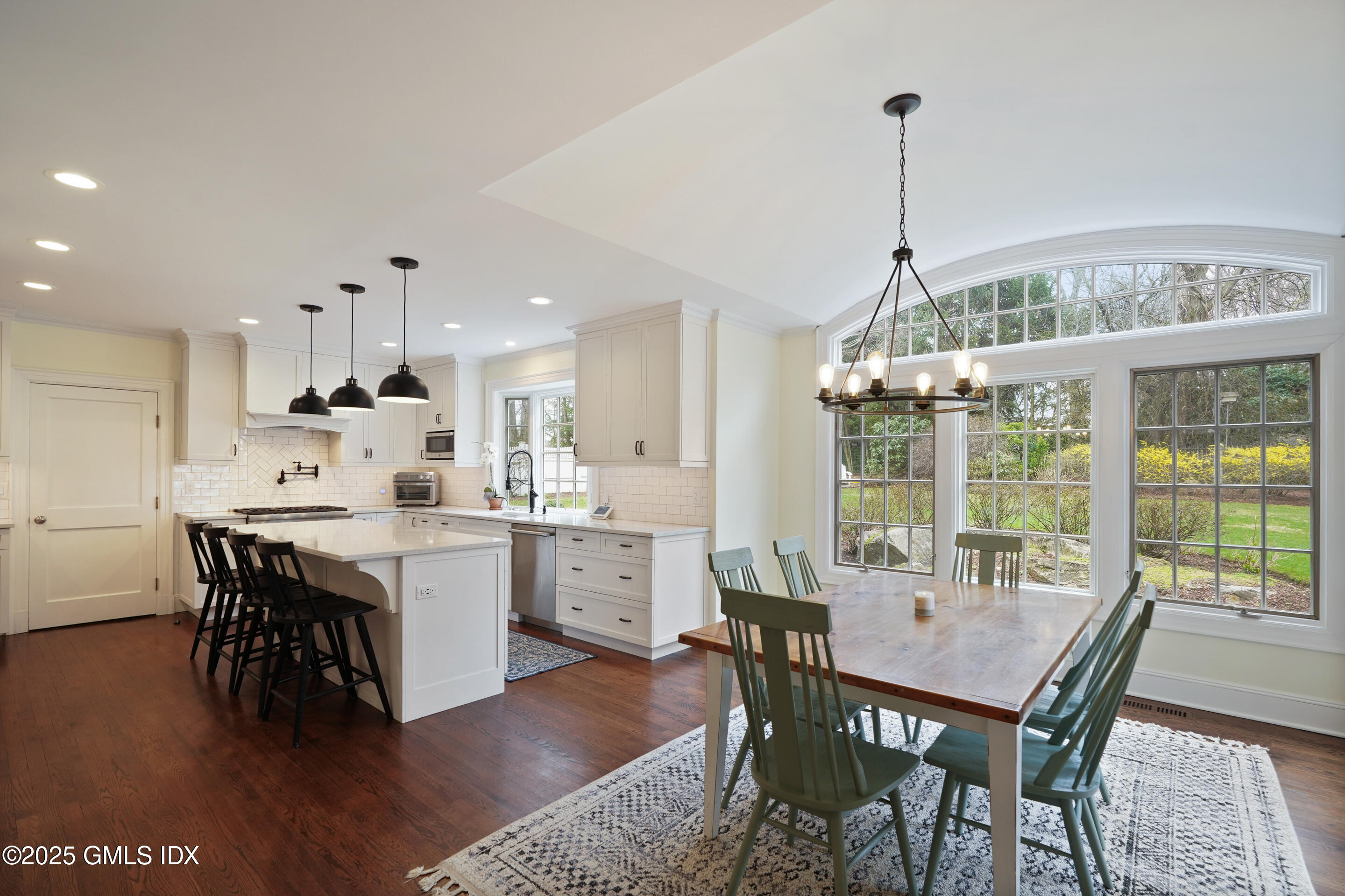 15 Anderson Road Greenwich, CT 06830 - Photo 4 of 7 a view of a dining room with furniture window and wooden floor