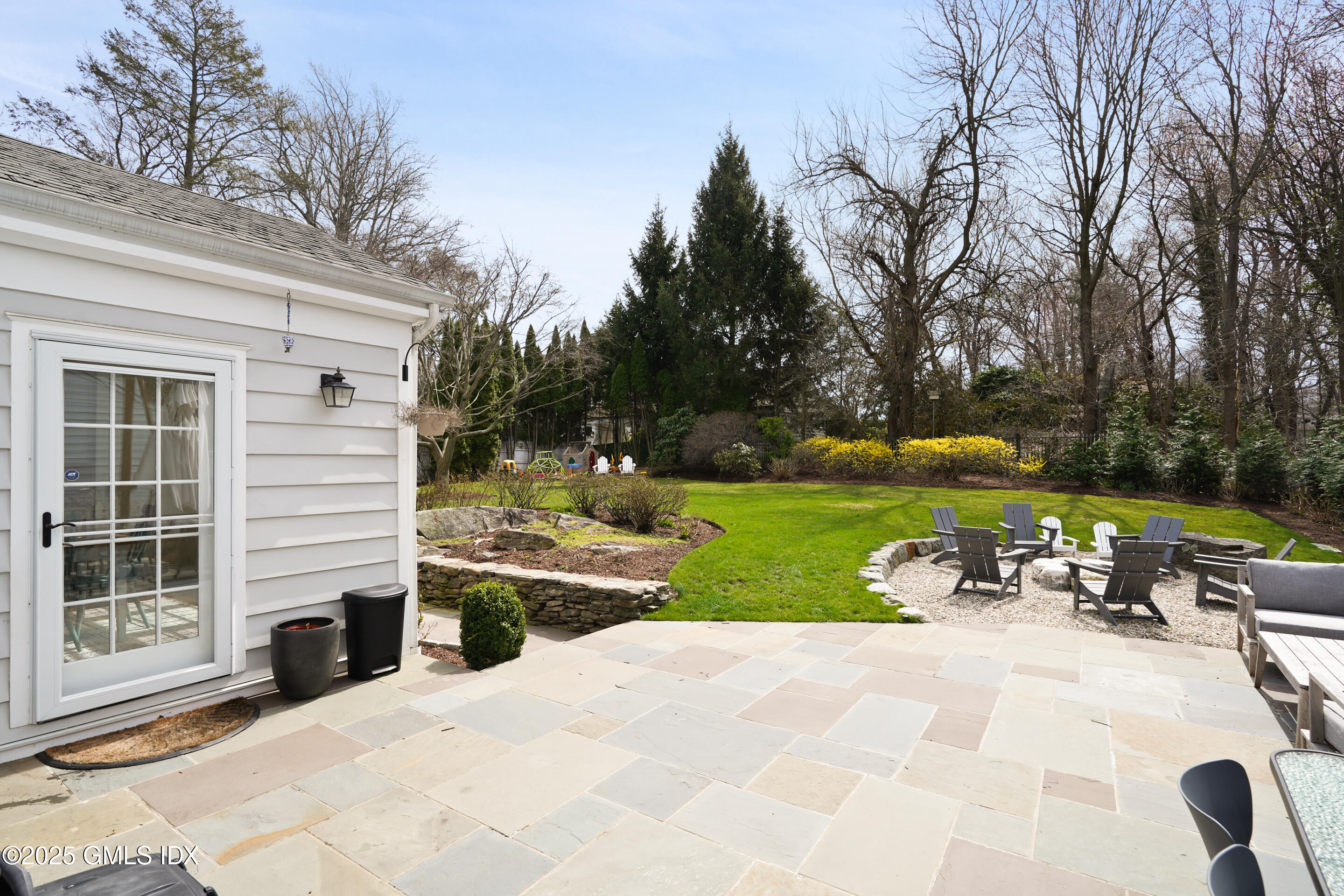 15 Anderson Road Greenwich, CT 06830 - Photo 5 of 7 a view of a house with backyard and sitting area