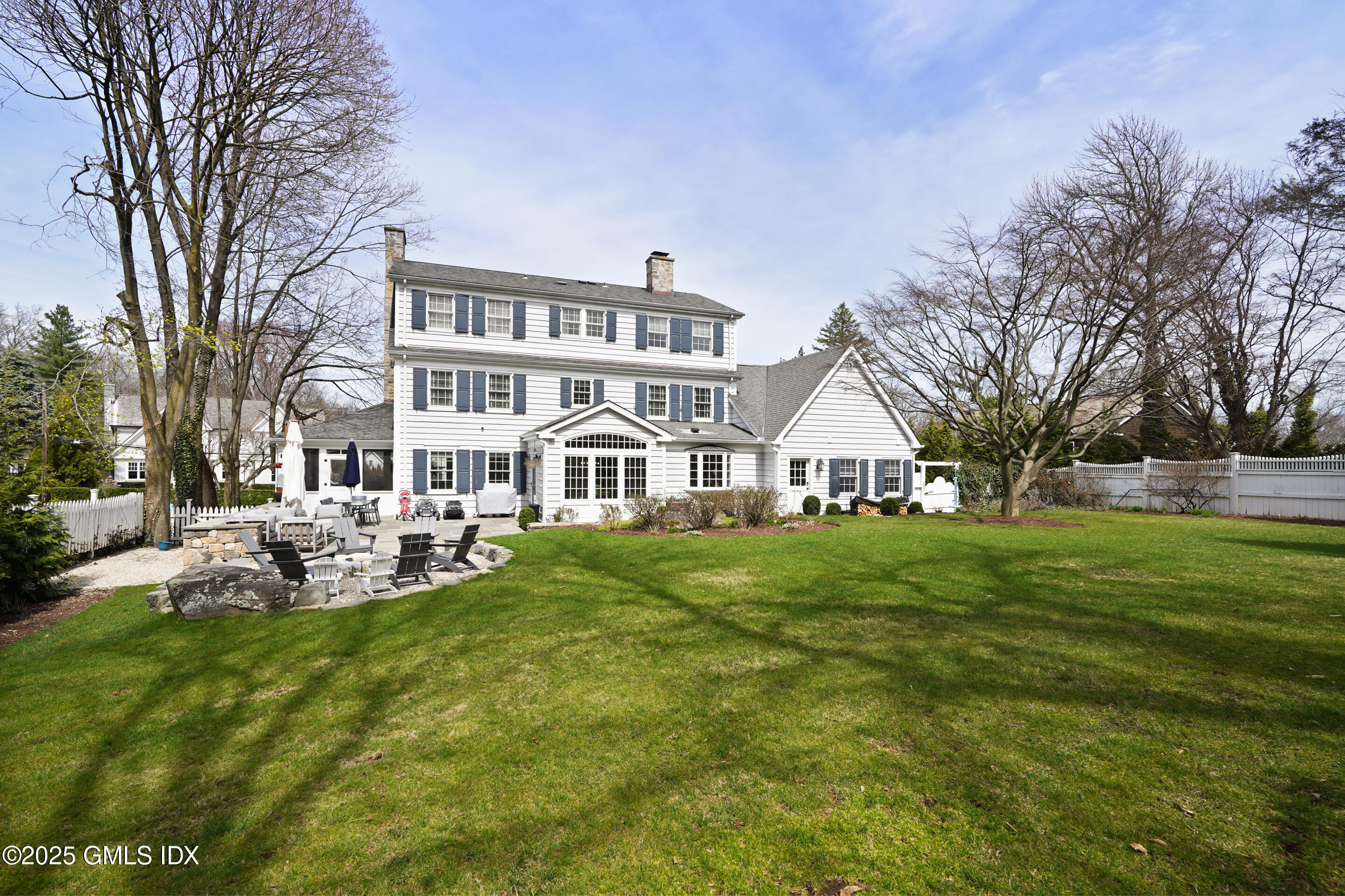15 Anderson Road Greenwich, CT 06830 - Photo 7 of 7 a view of a house with a big yard and large trees