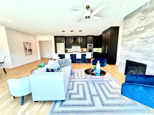 a kitchen with a sink and large window