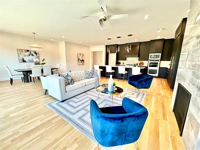 a living room with fireplace furniture and a fireplace