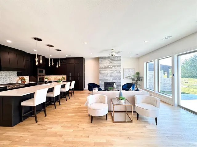 a living room with furniture a rug and a flat screen tv