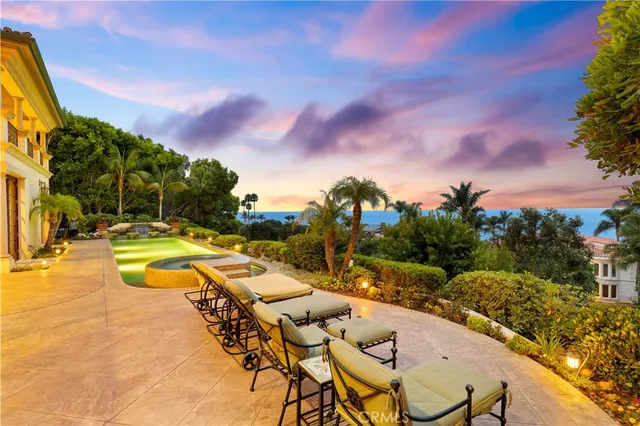 a view of a patio with swimming pool table and chairs