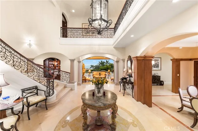 a view of a dining room with furniture and chandelier