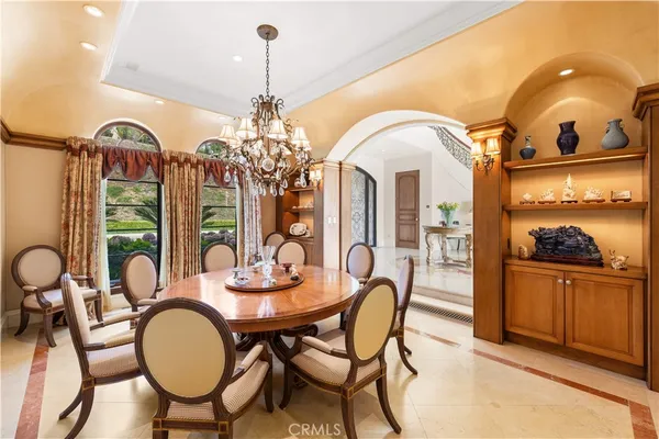 a kitchen with stainless steel appliances granite countertop a sink and a stove next to a window