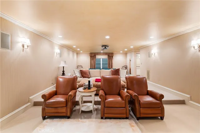 a living room with furniture fireplace and a large window