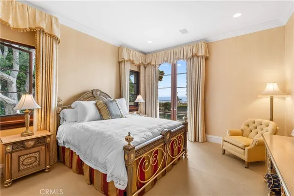 a view of a hallway with entryway wooden floor and front door