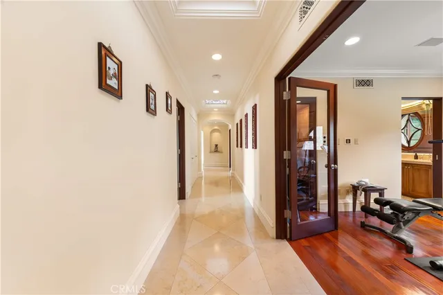 a large white kitchen with a large window