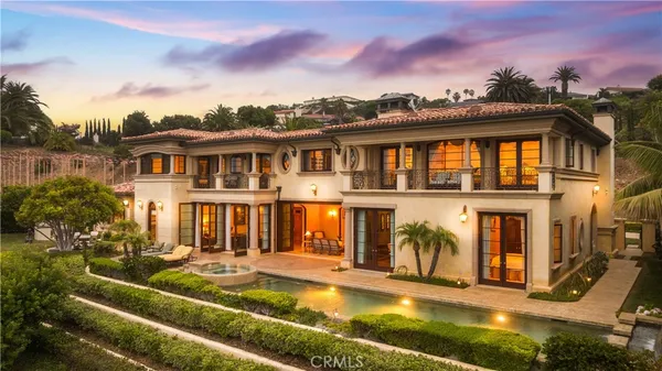 a front view of a house with garden and porch