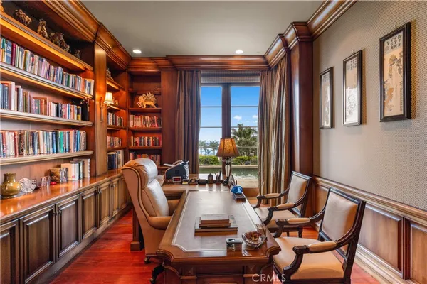 a large bedroom with a large bed and a large window