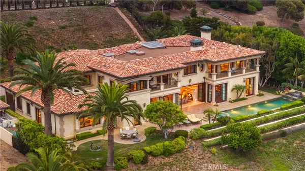 aerial view of a house with a yard