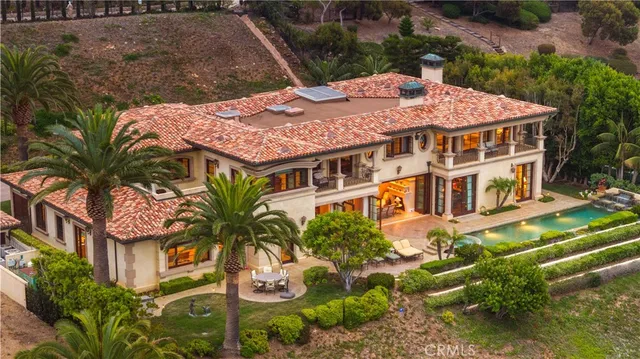 aerial view of a house with a yard