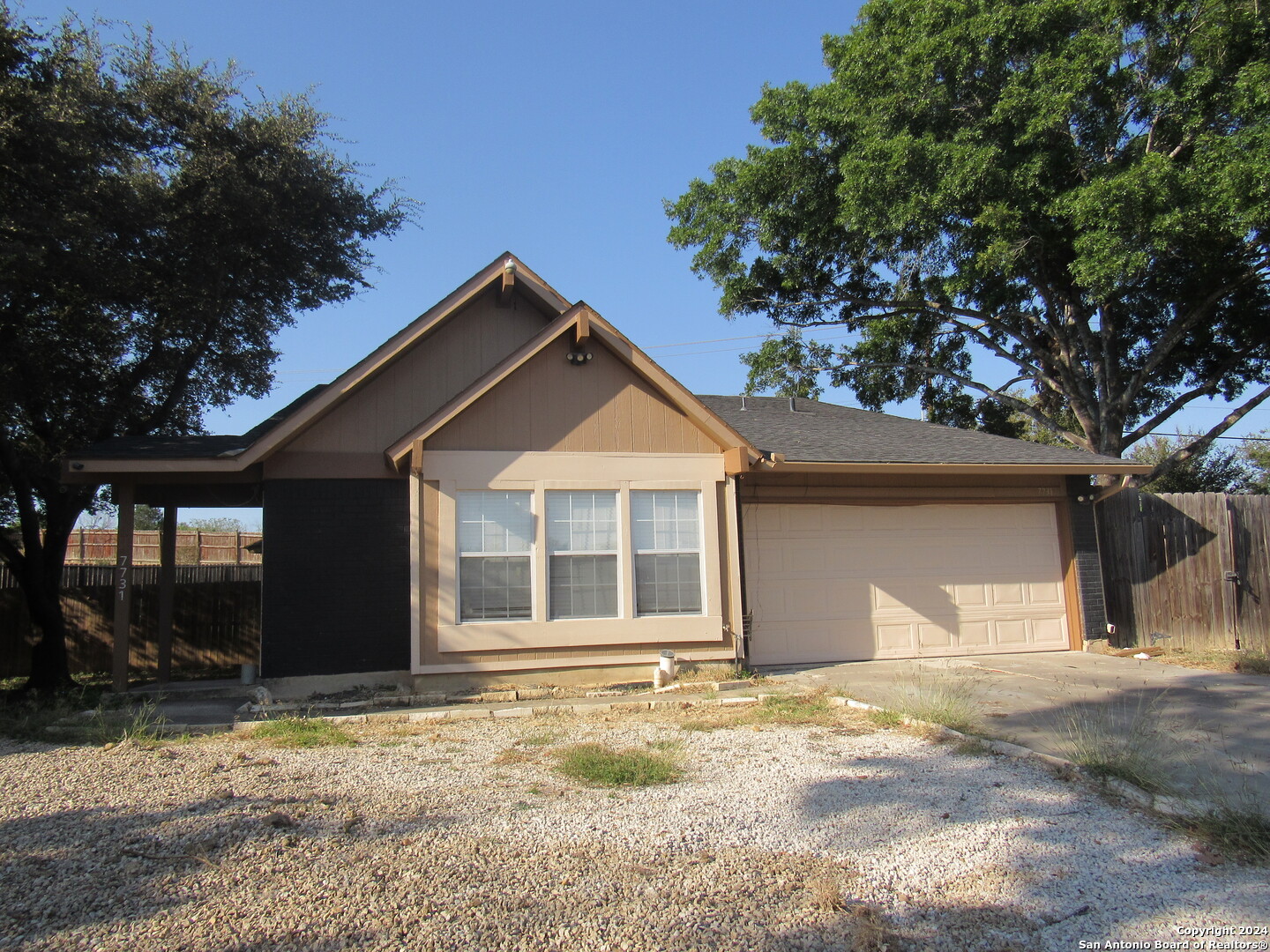 7731 Clear Ridge Drive San Antonio, TX 78239 - Photo 12 of 54 a house with trees in the background