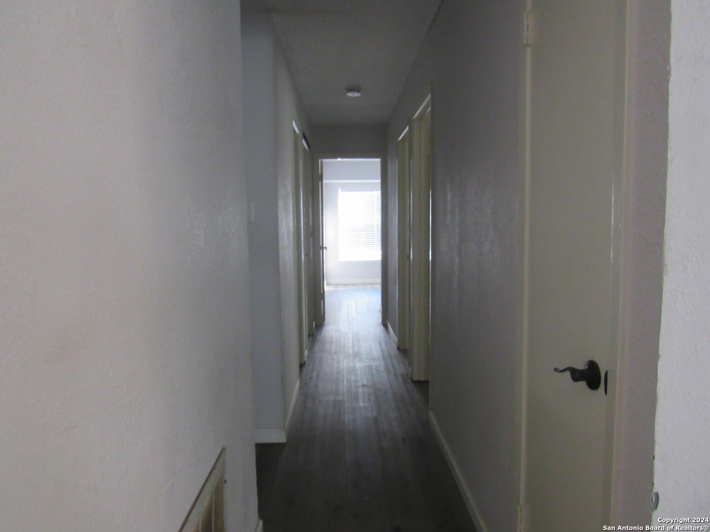 7731 Clear Ridge Drive San Antonio, TX 78239 - Photo 16 of 54 a view of a hallway with wooden floor and staircase